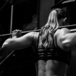 woman lifting barbell